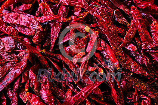 Dried dry red spicy chili peppers pile at asian market close up texture background. Sardar Market, Jodhpur, Rajasthan, India Dried dry red spicy chili peppers pile at asian market close up texture background. Sardar Market, Jodhpur, Rajasthan, India