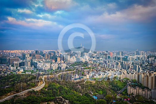 Aerial view of Seoul downtown cityscape and Namsan Seoul Tower on sunset from Inwang mountain. Seoul, South Korea. Aerial view of Seoul downtown cityscape and Namsan Seoul Tower on sunset from Inwang mountain. Seoul, South Korea.