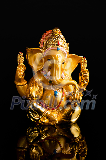 Ganesha statue isolated on black background with reflection Ganesha statue isolated on black background with reflection
