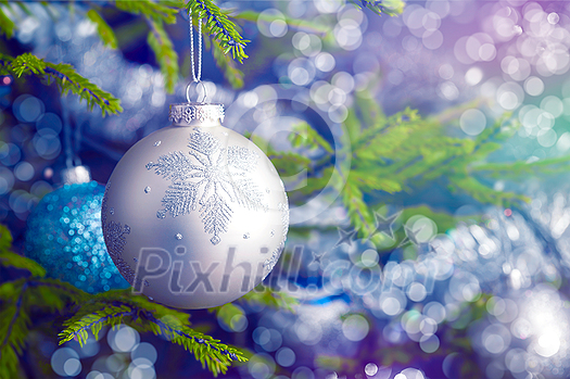 Christmas celebration holiday background - christmas-tree decoration bauble on decorated Christmas tree with defocused blurred lights bokeh and copyspalce Christmas celebration holiday background - christmas-tree decoration bauble on decorated Christmas tree with defocused blurred lights bokeh and copyspalce