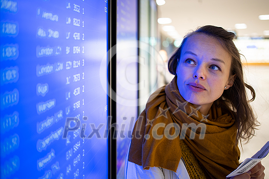 Canceled flight situation - Young, pretty female traveler learning about her flight being canceled, unable to get home today Canceled flight situation - Young, pretty female traveler learning about her flight being canceled, unable to get home today