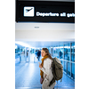 Canceled flight situation - Young, pretty female traveler learning about her flight being canceled, unable to get home today