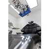 Dental treatment clinic interior with modern patient chair and a TV above