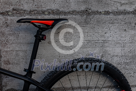 Modern mountain bike. Hydraulic bicycle disk brakes, grey metal disc attached to bike wheel close up, effective popular mountain bicycle brakes. Hydraulic disk brakes on bicycle wheel, bicycle spokes gray background Modern mountain bike. Hydraulic bicycle disk brakes, grey metal disc attached to bike wheel close up, effective popular mountain bicycle brakes. Hydraulic disk brakes on bicycle wheel, bicycle spokes gray background