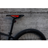 Modern mountain bike. Hydraulic bicycle disk brakes, grey metal disc attached to bike wheel close up, effective popular mountain bicycle brakes. Hydraulic disk brakes on bicycle wheel, bicycle spokes gray background