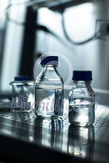 Research experiment glass in a flow, glove box in a chemistry lab Research experiment glass in a flow, glove box in a chemistry lab