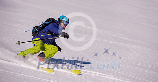 young athlete freestyle Skier having fun while running downhill in beautiful Alpine landscape on sunny day during winter season young athlete freestyle Skier having fun while running downhill in beautiful Alpine landscape on sunny day during winter season