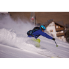 young athlete freestyle Skier having fun while running downhill in beautiful Alpine landscape on sunny day during winter season