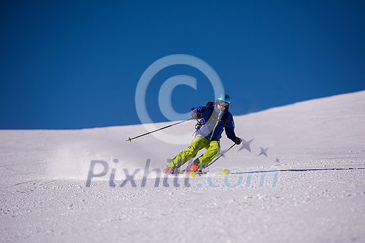 young athlete freestyle Skier having fun while running downhill in beautiful Alpine landscape on sunny day during winter season young athlete freestyle Skier having fun while running downhill in beautiful Alpine landscape on sunny day during winter season