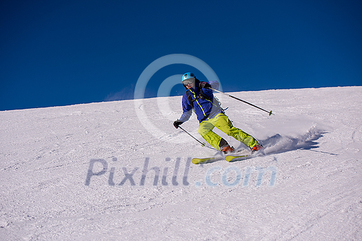 young athlete freestyle Skier having fun while running downhill in beautiful Alpine landscape on sunny day during winter season young athlete freestyle Skier having fun while running downhill in beautiful Alpine landscape on sunny day during winter season