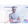 Portrait of young businessman in front of his modern office