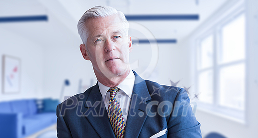 Portrait of senior businessman in front of his modern office