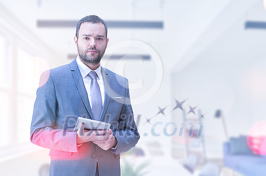 Portrait of senior businessman using tablet in front of his modern office