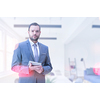 Portrait of senior businessman using tablet in front of his modern office