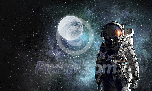 Astronaut against dark night sky background. Mixed media Astronaut against dark night sky background. Mixed media