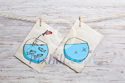 Paper sheet with sketches hanging on rope. Mixed media Paper sheet with sketches hanging on rope. Mixed media