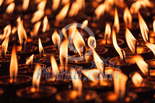 Burning candles in Buddhist temple. Dharamsala, Himachal Pradesh