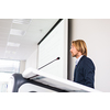 Handsome young man giving a speech at a conference