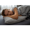 Pretty, young woman sleeping in her bed with her cell phone close to her. Smartphone in Bed Mobile/smartphone  Addiction Concept.