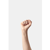 Female hand clenched fist raised up in victory, isolated on a white background.