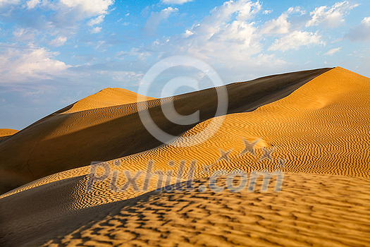 Sam Sand dunes of Thar Desert under beautiful sky on sunset. Rajasthan, India Sam Sand dunes of Thar Desert under beautiful sky on sunset. Rajasthan, India