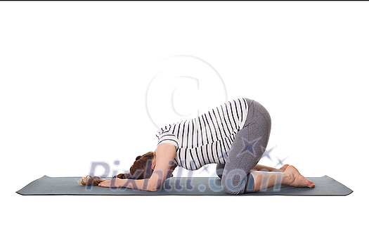 Pregnancy yoga exercise - pregnant woman doing asana Balasana - child s pose isolated on white background Pregnancy yoga exercise - pregnant woman doing asana Balasana - child s pose isolated on white background