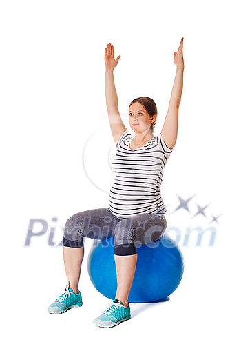 Pregnancy exercise concept - pregnant woman doing exercises with exercise ball isolated on white background Pregnancy exercise concept - pregnant woman doing exercises with exercise ball isolated on white background