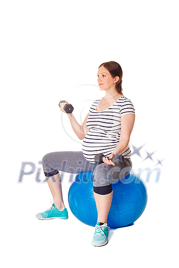 Pregnancy exercise concept - pregnant woman doing exercises with exercise ball and barbells isolated on white background Pregnancy exercise concept - pregnant woman doing exercises with exercise ball and barbells isolated on white background