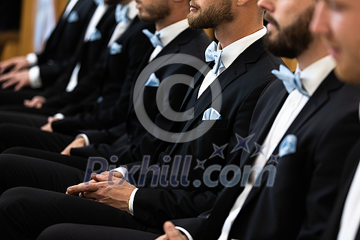 Guests sit on benches during a wedding in the Catholic Church. Guests sit on benches during a wedding in the Catholic Church.