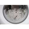 Close-up laundry running washing machine at home, amid a washing cycle, home electronics concept