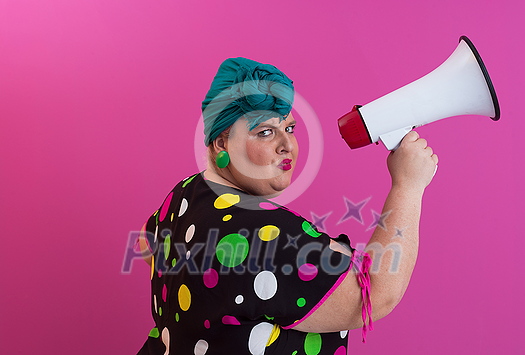 Funny plus size woman woman posing isolated on pink background studio portrait. People emotions lifestyle concept. Mock up copy space. Screaming in megaphone. High quality photo Funny plus size woman woman posing isolated on pink background studio portrait. People emotions lifestyle concept. Mock up copy space. Screaming in megaphone. High quality photo