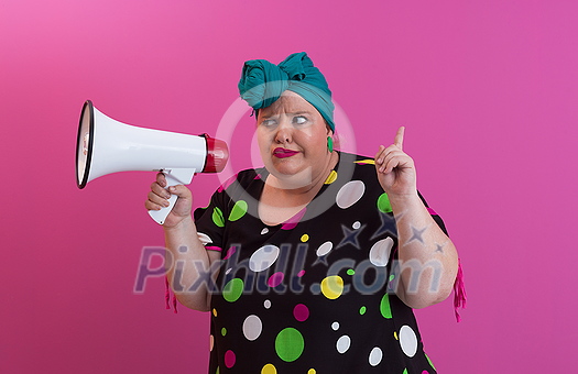 Funny plus size woman woman posing isolated on pink background studio portrait. People emotions lifestyle concept. Mock up copy space. Screaming in megaphone. High quality photo Funny plus size woman woman posing isolated on pink background studio portrait. People emotions lifestyle concept. Mock up copy space. Screaming in megaphone. High quality photo