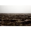 Fertile, dark soil, field after plowing. Getting ready for the next growing season being turned by plowing