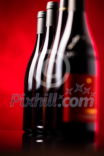 Bottles of quality red wines shot with shallow DOF; color toned image Bottles of quality red wines shot with shallow DOF; color toned image