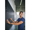 Students in a classroom - handsome student solving a math problem on a blackboard during math class