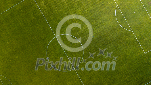 Aerial view of green football, soccer pitch. Top down view on a green, empty soccer field Aerial view of green football, soccer pitch. Top down view on a green, empty soccer field