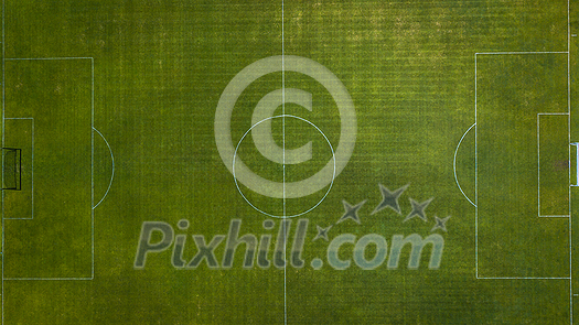 Aerial view of green football, soccer pitch. Top down view on a green, empty soccer field