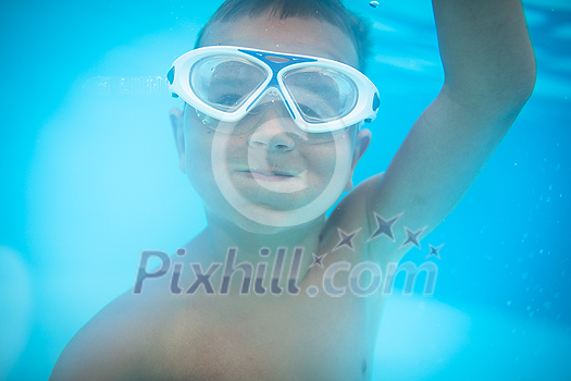 Cute little boy in a swimming pool Cute little boy in a swimming pool