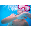 Cute little boy in a swimming pool, diving, swimming underwater, having fun