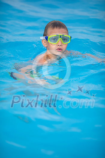 Cute little boy in a swimming pool Cute little boy in a swimming pool