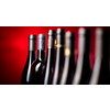 Bottles of quality red wines shot with shallow DOF; color toned image