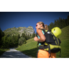 Pretty, female climber on a via ferrata -  climbing on a rock in Swiss Alps - Approach phase