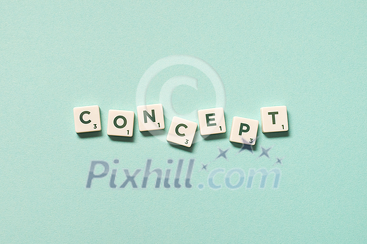 Word concept formed of scrabble blocks on turquoise background, still life with copy space. Word concept formed of scrabble blocks on turquoise background, still life with copy space.