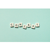 Word concept formed of scrabble blocks on turquoise background, still life with copy space.