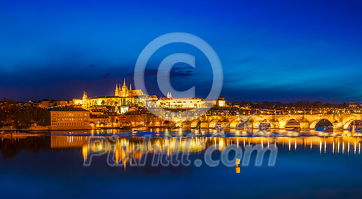 View of famous torist attraction destination - Charles Bridge (Karluv most) and Prague Castle (Prazsky hrad) in twilight. Prague, Czech Republic. Stitched panorama View of famous torist attraction destination - Charles Bridge (Karluv most) and Prague Castle (Prazsky hrad) in twilight. Prague, Czech Republic. Stitched panorama