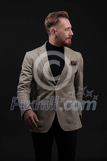 Confident businessman walking forward wearing a causal suit, handsome senior business man hero shot portrait isolated on black. High quality photo Confident businessman walking forward wearing a causal suit, handsome senior business man hero shot portrait isolated on black. High quality photo