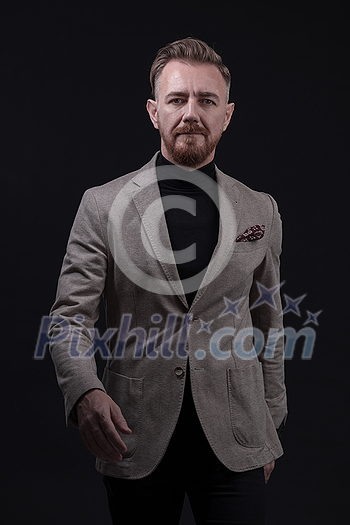 Confident businessman walking forward wearing a causal suit, handsome senior business man hero shot portrait isolated on black. High quality photo Confident businessman walking forward wearing a causal suit, handsome senior business man hero shot portrait isolated on black. High quality photo