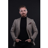 portrait of a stylish elegant businessman looking at camera in photo studio on dark background with hard light. High quality photo