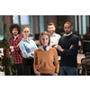 Portrait of a successful creative business team looking at camera and smiling. Diverse businesspeople standing together at startup. Selective focus. High-quality photo