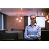 Portrait of freelancer standing in co-working space. Confident businesswoman looking at camera. High-quality photo